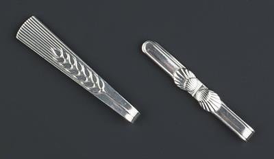 Lot 238 - Georg Jensen 
Two silver tie slides
one with shell design, the other with wheat design
numbered 72