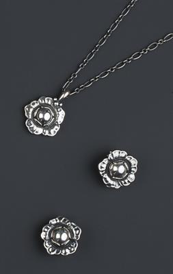 Lot 239 - Georg Jensen 
Silver flowerhead suite
comprising pendant and pair of earclips
numbered 2002
signed