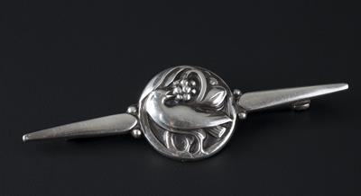 Lot 249 - Georg Jensen
Bar brooch
depicting a dove amongst foliage, to tapered bar
numbered 211
signed and