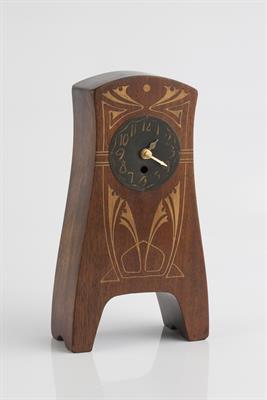 Lot 290 - Art Nouveau
Oak mantel clock
inlaid with sinuous linear design and metal dial with Arabic