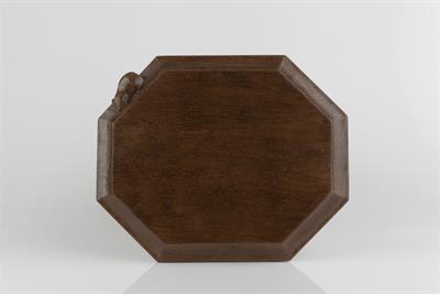 Lot 311 - Robert Thompson of Kilburn (British, 1876-1955)
Mouseman oak bread board
of octagonal form
carved