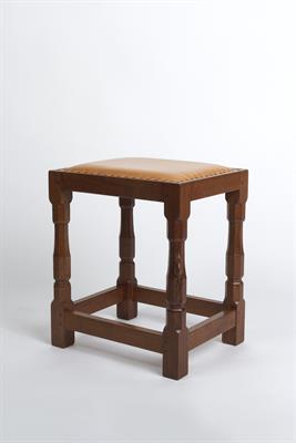 Lot 318 - Robert Thompson of Kilburn (British, 1876-1955)
Mouseman oak dressing stool
with leather seat, on