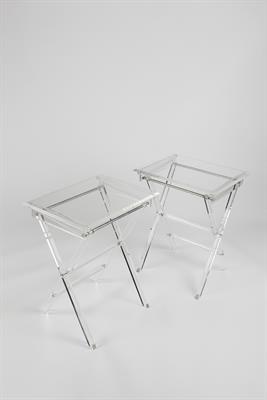 Lot 349 - American School
Pair of Modernist lucite bevelled occasional tables, 1970s
folding form
51cm across