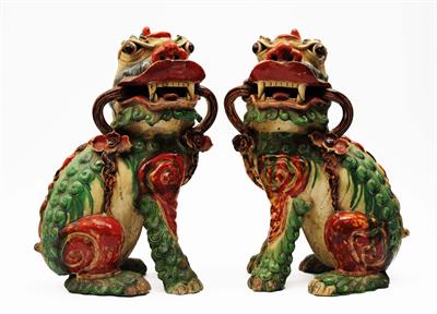 Lot 54 - A pair of Chinese Sancai-style glazed Dogs of Fo