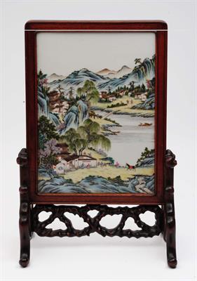 Lot 79 - A Chinese polychrome plaque