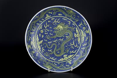 Lot 90 - A blue and yellow glazed dragon dish