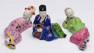 Lot 99 - Two Chinese recumbent polychrome figures