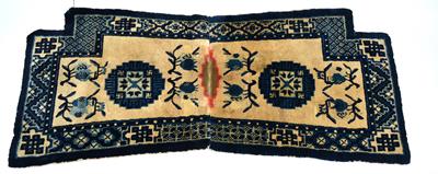 Lot 102 - A Chinese cream ground pony saddle rug