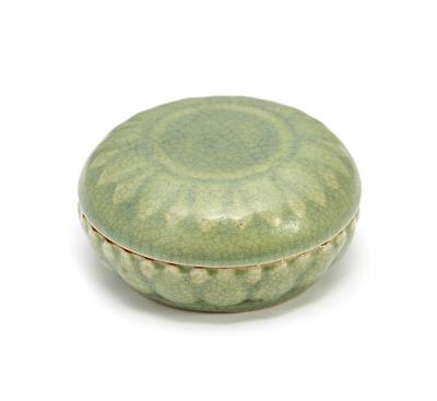 Lot 151 - A Chinese Longquan celadon circular box and cover