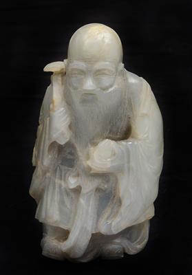 Lot 183 - A Chinese pale bluish grey jade figure