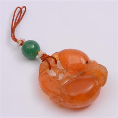 Lot 186 - A Chinese orange red chalcedony pendant