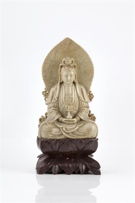 Lot 206 - A Chinese grey soapstone figure of a seated Guanyin