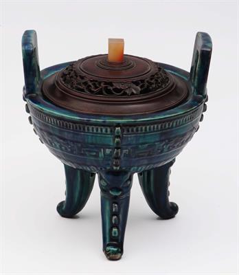 Lot 208 - A Chinese Fahua style glazed archiac style two handled tripod ding