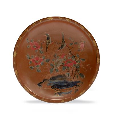 Lot 215 - A Chinese brown lacquer saucer shaped dish