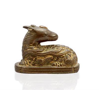 Lot 222 - A Chinese partially gilded bronze scroll weight