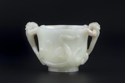 Lot 251 - A Chinese pale celadon jade chilong cup