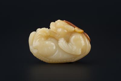 Lot 252 - A Chinese yellow cornelian carving of a lion dog