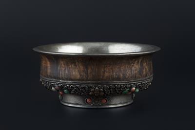 Lot 253 - A Tibetan burl wood and silver bowl