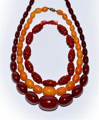 Lot 261 - A Chinese burgundy amber necklace