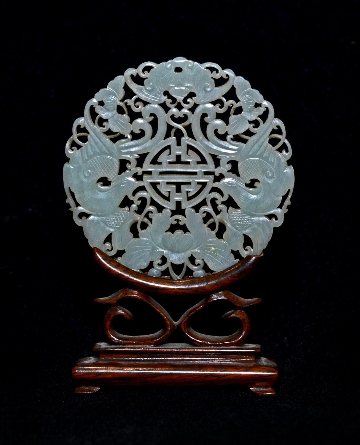 Lot 269 - A Chinese pierced and carved mutton fat jade medallion