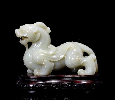 Lot 280 - A Chinese pale Celadon jade carving of a kylin