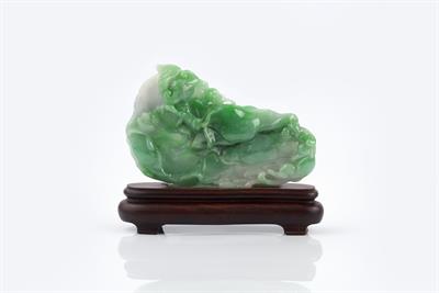 Lot 289 - A Chinese emerald green and white jade boulder