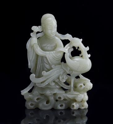 Lot 297 - A Chinese white jade model of Quanyin