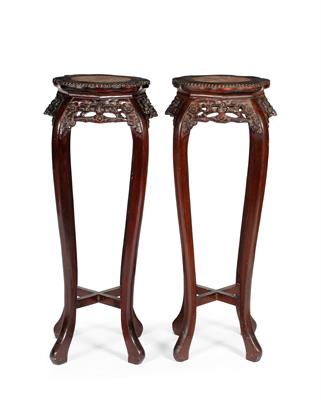 Lot 308 - A pair of Chinese stained wood urn stands