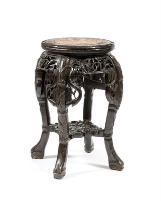 Lot 309 - A Chinese hardwood low urn stand