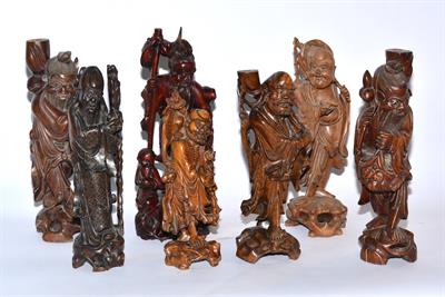 Lot 311 - A collection of seven carved Chinese figures