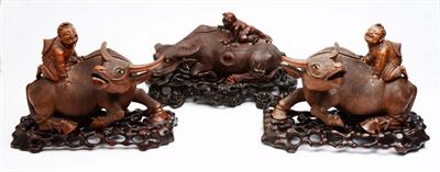 Lot 314 - Three Chinese carved wood water buffalo