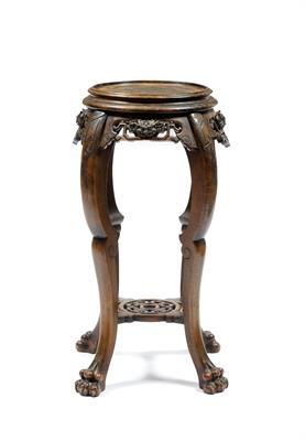 Lot 326 - A Chinese hardwood urn stand