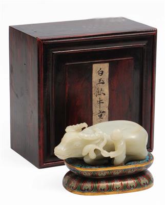 Lot 379 - A Chinese white jade carving of a recumbent water buffalo