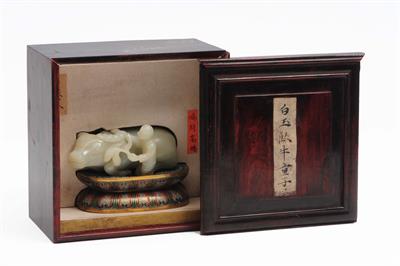 Lot 379 - A Chinese white jade carving of a recumbent water buffalo