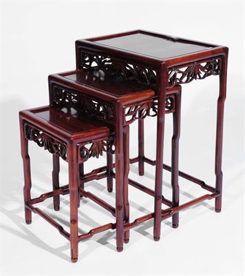 Lot 383 - A Chinese nest of three hardwood occasional tables