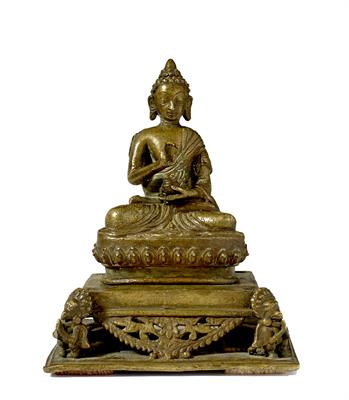 Lot 407 - A Tibetan bronze seated Buddha