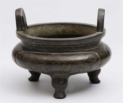 Lot 418 - A Chinese bronze ding on tripod feet