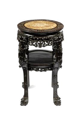 Lot 435 - A Chinese hardwood large circular urn stand