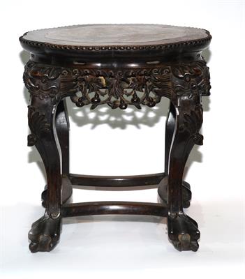 Lot 443 - A Chinese hardwood low urn stand