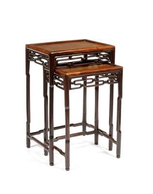 Lot 445 - A nest of two Chinese hardwood occasional tables