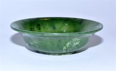 Lot 463 - A Chinese spinach green hardstone bowl