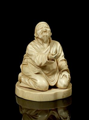 Lot 521 - A Japanese ivory okimono