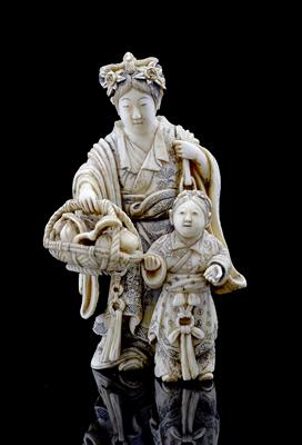Lot 527 - A Japanese ivory okimono