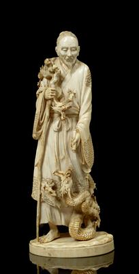 Lot 529 - A Japanese ivory okimono
