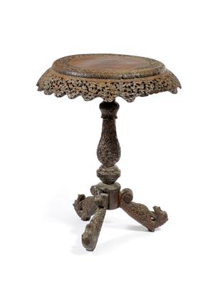 Lot 530 - A Burmese carved hardwood occasional table