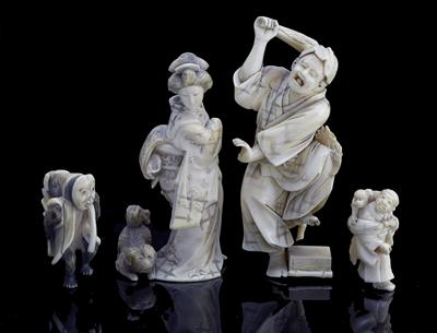 Lot 543 - A Japanese ivory okimono of a frightened gentleman raising a club