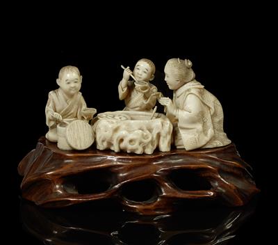 Lot 544 - A Japanese ivory okimono