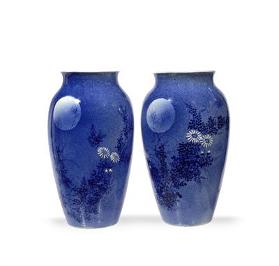 Lot 579 - A pair of Japanese pale blue vases