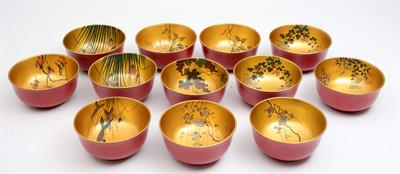 Lot 584 - A set of twelve Japanese red lacquer bowls