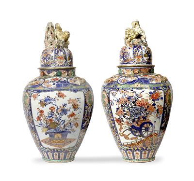 Lot 585 - A pair of Japanese Arita large ovoid vases and covers